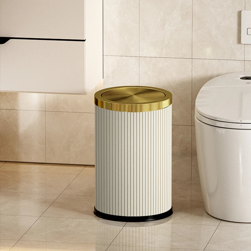 Poubelle ronde design imitation cuir avec couvercle doré