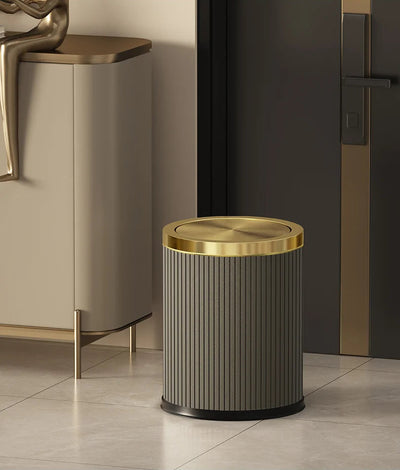 Poubelle ronde design imitation cuir avec couvercle doré